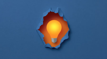 A glowing idea icon emerging from a torn paper center, suggesting breakthrough thinking and creativity with spaceの素材