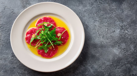 Classic beef carpaccio plated with olive oil and arugula, elegant raw dish with minimalist presentation and spaceの素材