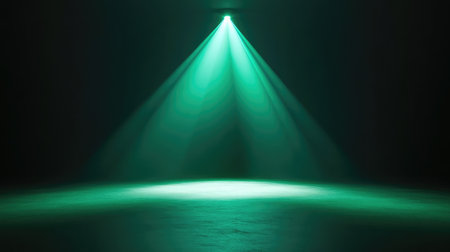 A glowing green spotlight in the middle of an empty room, with smooth gradients of light flowing outward. No text, no people.の素材