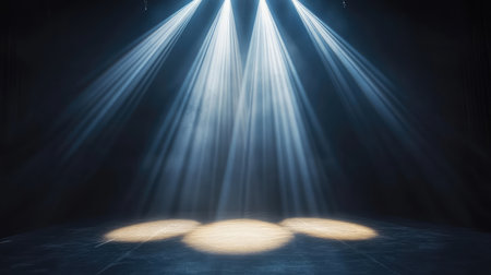 Bright club spotlight illuminating the floor in an empty venue, with defined beams of light creating a sharp contrast with the surrounding shadows of the room. No text, no people.の素材