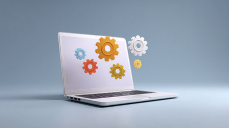 A modern laptop showcases vibrant gears floating above its screen, symbolizing innovation and technology for improved productivity in a creative workspace.の素材