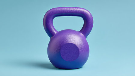 This vibrant purple kettlebell on a light blue backdrop serves as an eye-catching representation of fitness and strength training, perfect for home workouts or gym settings.の素材
