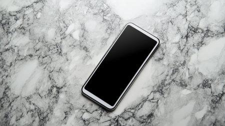 Top view of touchscreen phone lying flat on marble surface, minimalistic background with elegant copy spaceの素材