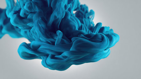 This stunning image captures vibrant blue ink swirling gracefully in motion, showcasing the beauty of fluid dynamics and abstract art with intricate patterns and textures.の素材