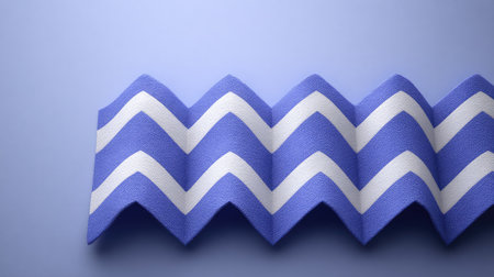 This vibrant zigzag fabric features a striking blue and white design, perfect for various design projects, fashion, and home decor. Its unique texture adds depth and character.の素材