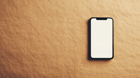 A mobile phone with blank screen lying on textured paper background with minimal shadows, flat lay composition for branding or app mockupの素材