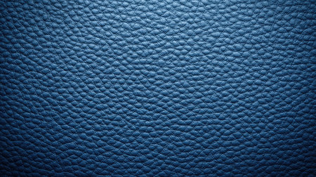 Blue leather texture close-up with natural grain and shadows, flat lay with blank space for product displayの素材