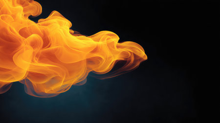 Black background with orange smoke swirls and blank copy spaceの素材
