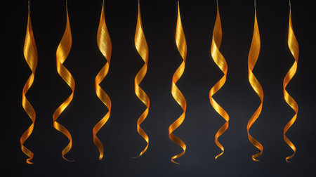 Metallic streamers and party decor on black backdrop with copy spaceの素材