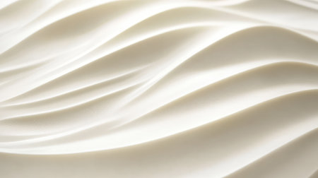 Surface of sand dunes with wavy textures under soft sunlight, natural flowing lines for earthy copy spaceの素材