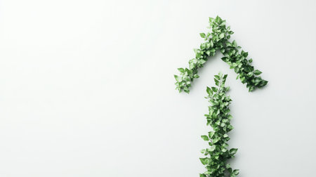 A creative arrangement of green ivy leaves shaped like arrows on a clean white background, representing growth, positivity, and a commitment to nature and environmental sustainability.の素材