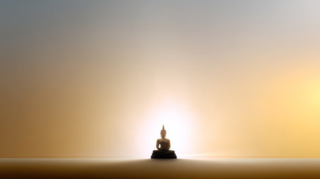 A striking image of a Buddha statue set against a gentle gradient sunrise background, evoking feelings of peace, tranquility, and spiritual reflection.の素材