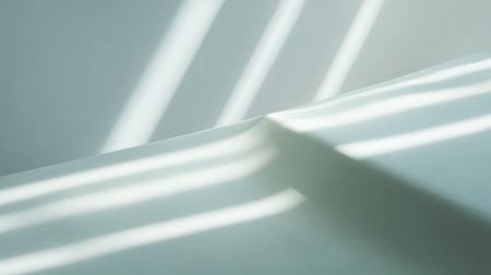 This image captures the interplay of soft light and gentle shadows on a white surface, evoking a sense of calmness and minimalism. Perfect for modern art lovers.の素材