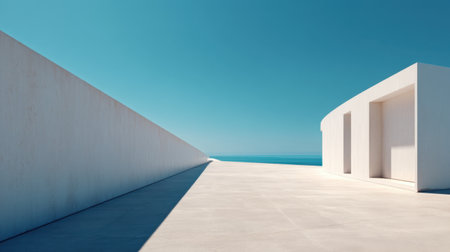 A stunning view of a minimalist architectural space showcasing clean lines and geometric shapes against a backdrop of blue sky and ocean, promoting tranquility and serenity.の素材