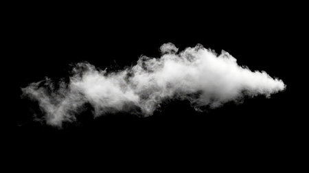 A solitary white vapor cloud on a deep black background creates a striking visual contrast. Perfect for artistic projects, designs, or as a background element.の素材