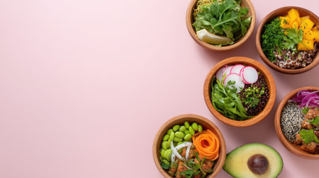 A vibrant arrangement of fresh ingredients in wooden bowls showcases healthy meals on a soft pink background, ideal for nutrition and wellness themes.の素材