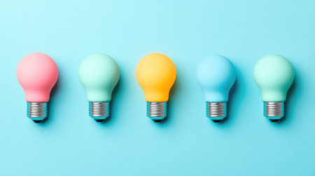 A series of lightbulbs arranged in a row, each glowing brighter as they move along, symbolizing successful ideas and innovation, with space for marketing copyの素材