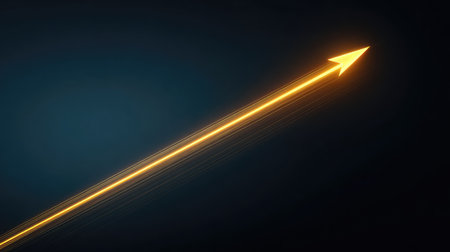 A vibrant golden arrow ascends with radiant light trails set against a dark background, symbolizing growth, progress, and success in various endeavors.の素材