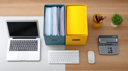 A modern workspace featuring a laptop, file storage boxes, colorful office supplies, and a calculator arranged neatly on a wooden desk to enhance productivity.の素材