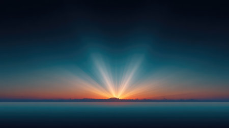 A stunning view of a vibrant sunrise illuminating the calm ocean, featuring long rays of light spreading across the horizon, creating a peaceful atmosphere.の素材