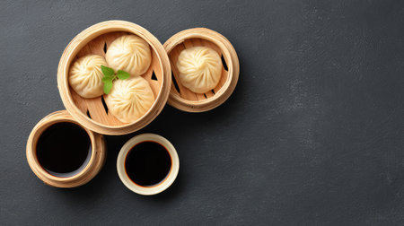 A beautiful arrangement of steamed dumplings in bamboo steamers complemented by soy sauce. Perfect for showcasing Asian cuisine in a culinary presentation.の素材