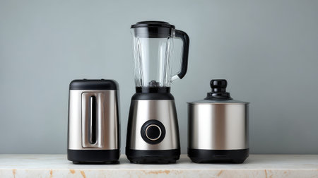 A stylish arrangement of modern kitchen appliances including a blender, toaster, and slow cooker, showcasing sleek designs and a metallic finish that enhances any kitchen decor.の素材