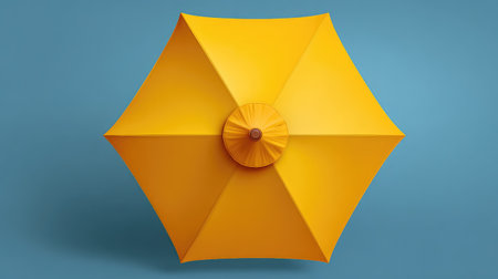 A vibrant yellow umbrella against a soft blue background, ideal for summer themes and playful marketing visuals, evoking feelings of joy and sunshine.の素材
