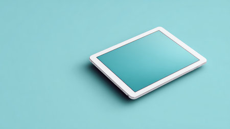 A sleek tablet rests on a soft blue surface, creating a contemporary feel perfect for showcasing digital tools, technology concepts, or creative design projects.の素材