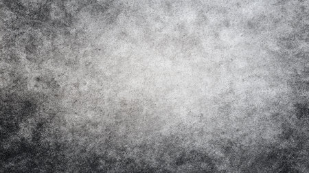 This image features a textured grey background with a gentle gradient, transitioning through various shades, ideal for artistic and design applications.の素材