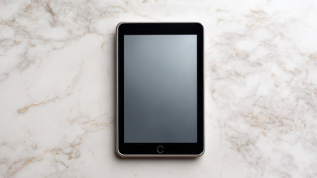 A sleek, modern tablet rests on a stylish marble surface, showcasing a blank screen ideal for digital mockups, marketing visuals, and lifestyle imagery.の素材