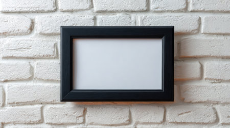 One clean picture frame on a white brick wall, classic gallery style with spaceの素材