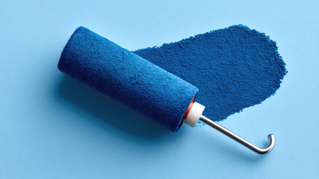 One sticky roller for paper lint placed on a bright surface with surrounding spaceの素材