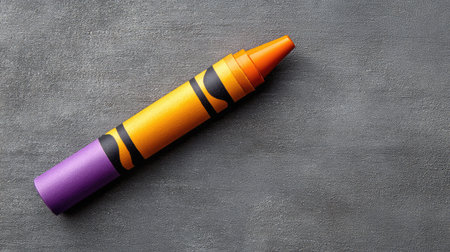 A wax crayon placed on a textured background, children's stationery close-up with spaceの素材