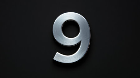 Metal number  on black velvet background, high contrast with minimalist layoutの素材