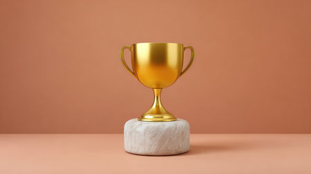 A striking golden trophy set on a marble base, perfect for symbolizing achievement and excellence in competitions, awards, and special events against a soft, warm background.の素材