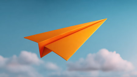A vibrant orange paper airplane flies gracefully against a clear blue sky dotted with fluffy white clouds, symbolizing creativity and the joy of flight. Perfect for artistic themes.の素材