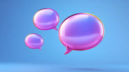 This image features vibrant speech bubbles in shades of pink, floating against a blue backdrop, symbolizing communication and interaction in a modern style.の素材