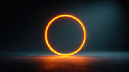 A mesmerizing glowing orange circle stands out against a deep dark background, creating a striking visual effect with soft blue hues, ideal for artistic and creative presentations.の素材