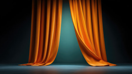 Stunning orange drapes create a warm, artistic atmosphere with soft lighting. Ideal for theatre setups or creative photography, providing an elegant and dramatic backdrop.の素材