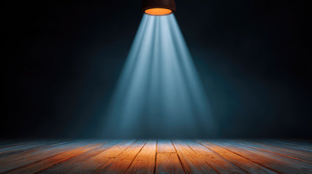 Captivating scene showcasing dramatic stage lighting with beams cutting through darkness, emphasizing warm wooden flooring and creating an engaging atmosphere for events and performances.の素材
