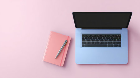 A modern workspace featuring a sleek laptop, a pink notebook, and a stylish pen, set against a soft pink background, ideal for inspiring creativity and enhancing productivity.の素材