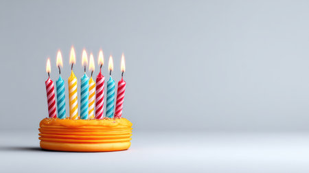 A bright and cheerful birthday cake featuring colorful candles, perfect for celebrating joyful moments and creating lasting memories during special occasions.の素材