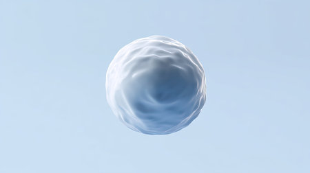 This abstract image features a smooth, spherical surface gently floating against a calm blue backdrop, evoking a sense of peace and simplicity.の素材