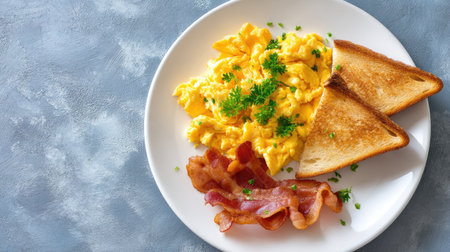 A tempting breakfast plate showcasing fluffy scrambled eggs, crispy bacon strips, and golden-brown toast, garnished with fresh parsley, perfect for any meal.の素材
