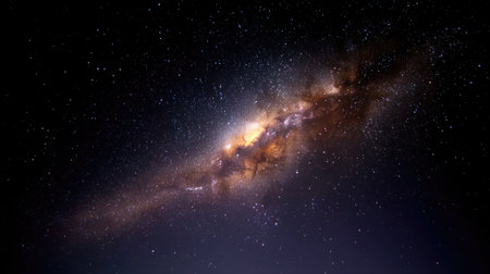 This captivating image captures a distant galaxy surrounded by countless stars, revealing the stunning beauty and mystery of the cosmos.の素材