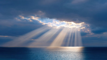 Majestic view of ocean waters beneath dynamic cloud cover, where sunlight breaks through, creating a peaceful and serene atmosphere, perfect for nature lovers.の素材