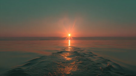 A breathtaking view of a sunset over a calm ocean, showcasing gentle waves and vibrant colors reflecting on the water's surface, perfect for tranquil moments.の素材
