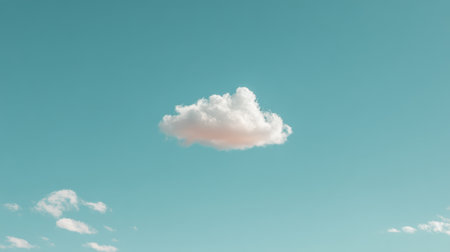 A soft white cloud floats gracefully in a clear blue sky, offering a serene and tranquil vibe. Ideal for backgrounds in creative projects or nature-themed designs.の素材