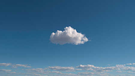 A beautiful, soft white cloud floats in a serene blue sky, surrounded by fluffy clouds, creating a tranquil atmosphere. Perfect for nature and landscape lovers.の素材