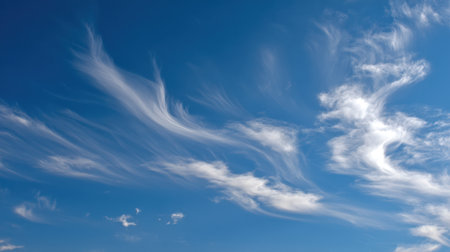 Capture the essence of a tranquil day with a stunning blue sky filled with delicate wispy clouds. Ideal for nature-inspired projects and calming visuals.の素材